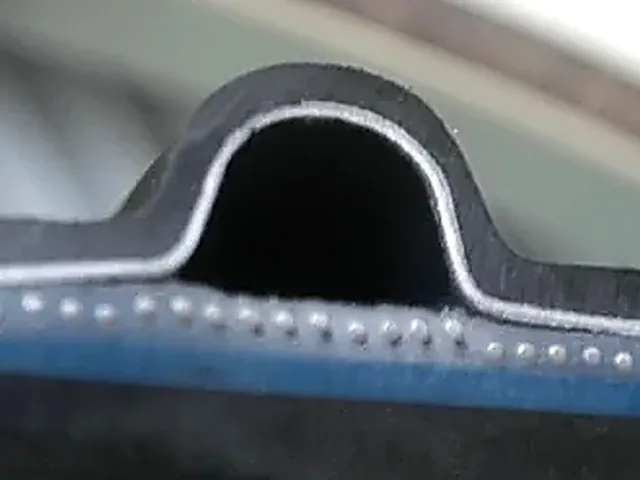Close view of a steel-reinforced PE structured-wall rib profile